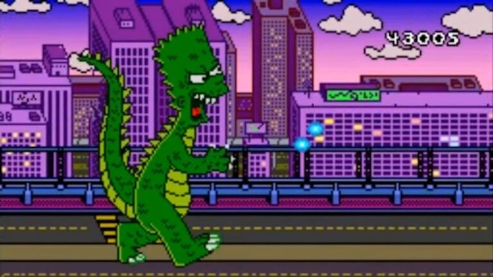 Cena em pixel‑art com um grande monstro verde semelhante a um dinossauro caminhando por uma rua da cidade. Ele tem espinhos nas costas, cauda longa e boca aberta com dentes. O fundo mostra prédios roxos e rosas, uma ponte elevada e céu em tons de rosa e azul. Orbes azuis brilham perto das mãos da criatura.