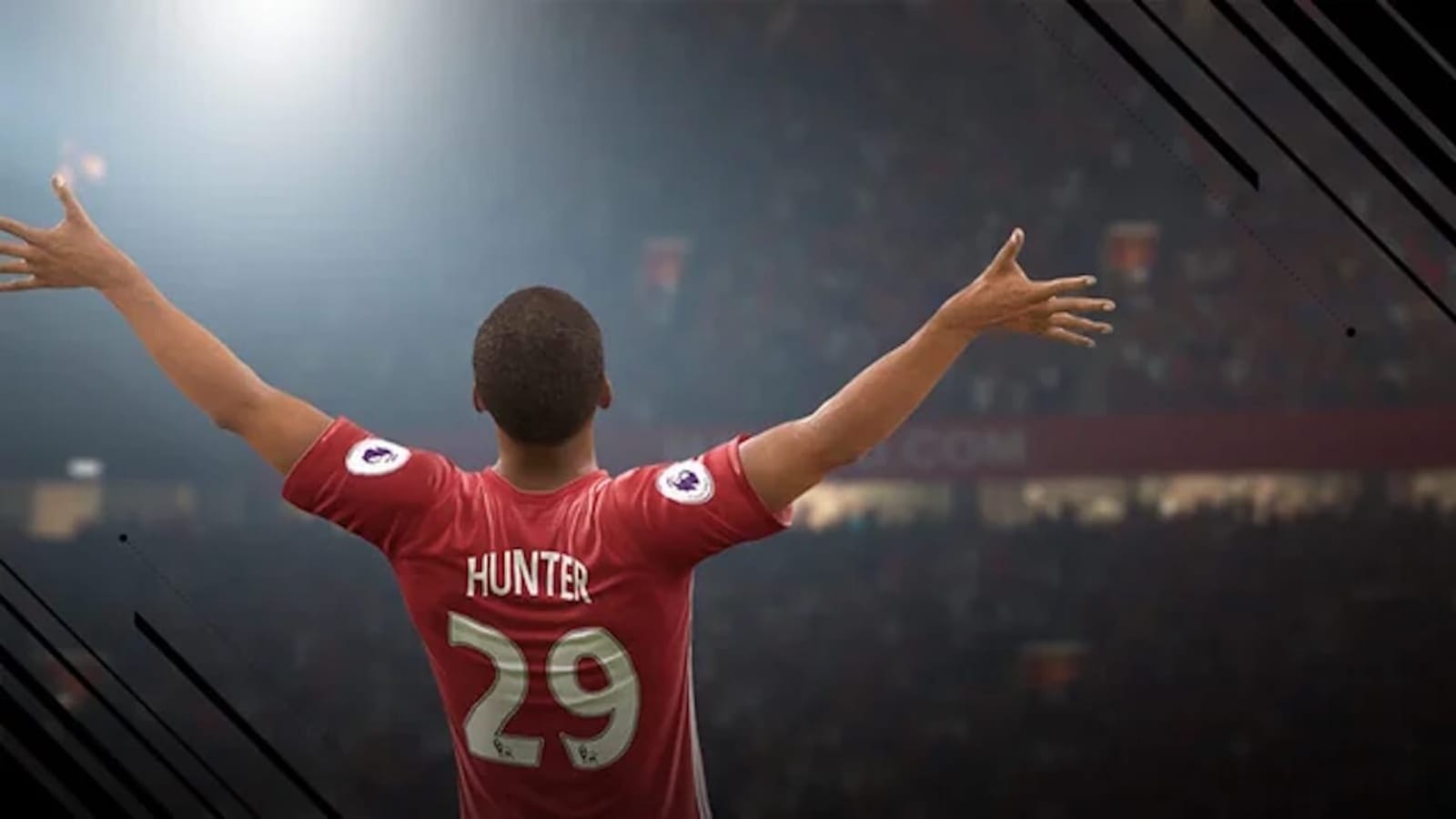 Jogador com camisa vermelha número 29 e nome Hunter celebra com braços abertos diante de torcida sob luzes fortes do estádio.