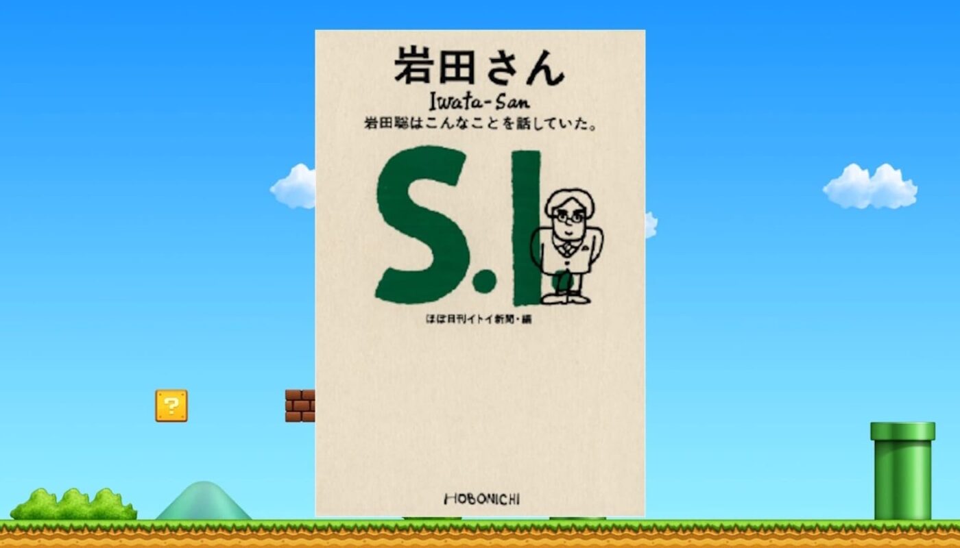 Capa do livro ‘Iwata‑San’ com ilustração simples de personagem de óculos sobre fundo inspirado em Mario, com céu azul, blocos e cano verde.