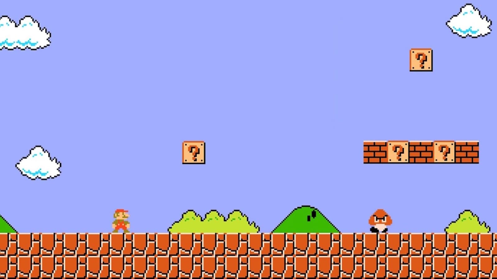 Tela de Super Mario Bros. com Mario sobre plataforma de tijolos, céu azul, nuvens, colinas verdes, blocos com interrogação e Goomba à direita.