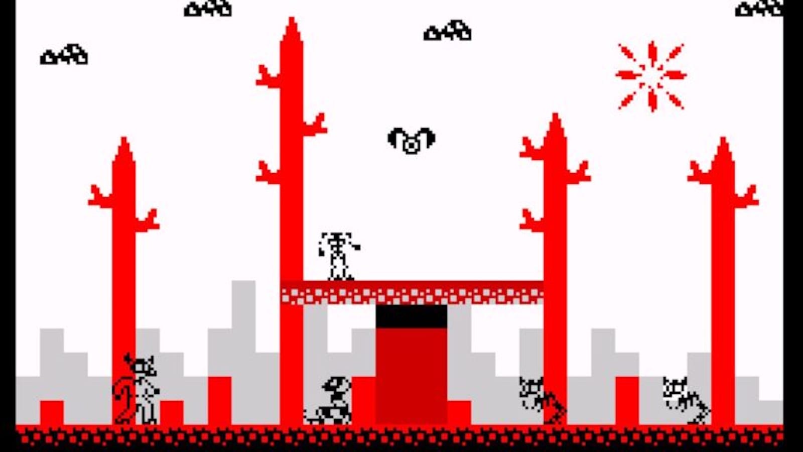 Cena de videogame em pixel‑art com paleta vermelha, preta e cinza. O fundo mostra formas retangulares que lembram prédios. No primeiro plano há árvores vermelhas com galhos curtos. Pequenas criaturas pretas voam no céu, enquanto figuras humanoides e animais aparecem no chão e em plataformas. No canto superior direito há um sol ou estrela estilizado em vermelho.